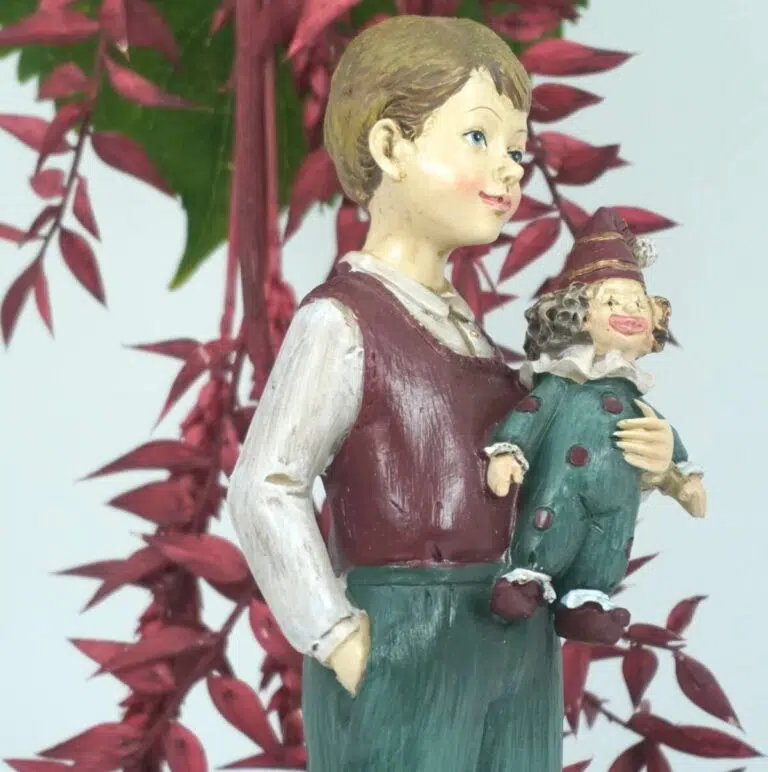 Dekofigur Clayre & Eef Jungen Figur mit Clown Puppe